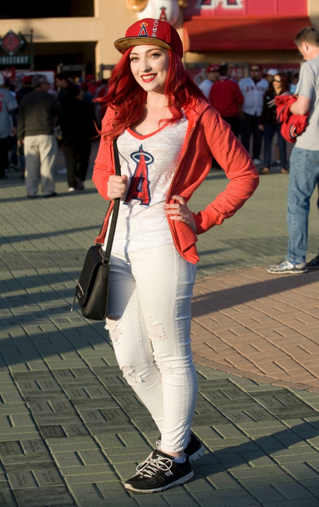 Hollie Forrest, 22, was spotted at the Angels game on Wednesday in Anaheim wearing an Angels baseball hat and T-shirt, white American Eagle jeans and Bite Beauty lipstick in the color Pomegranate.