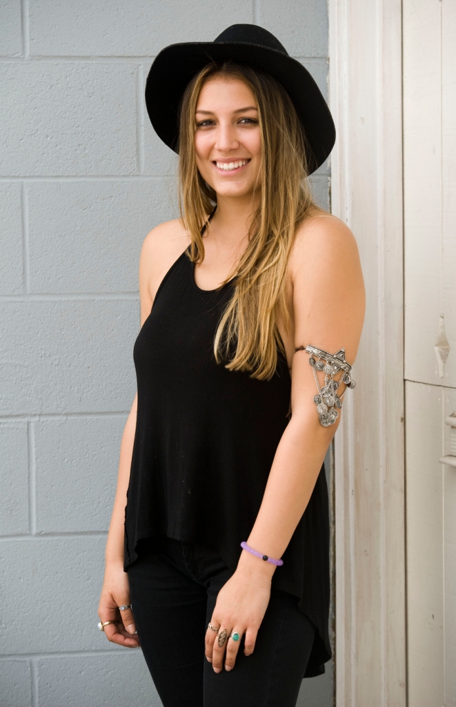 Sydney Olmos, 19, was spotted wearing an arm cuff from Isabelle's Cabinet black wool hat and a Brandy Melville top. 